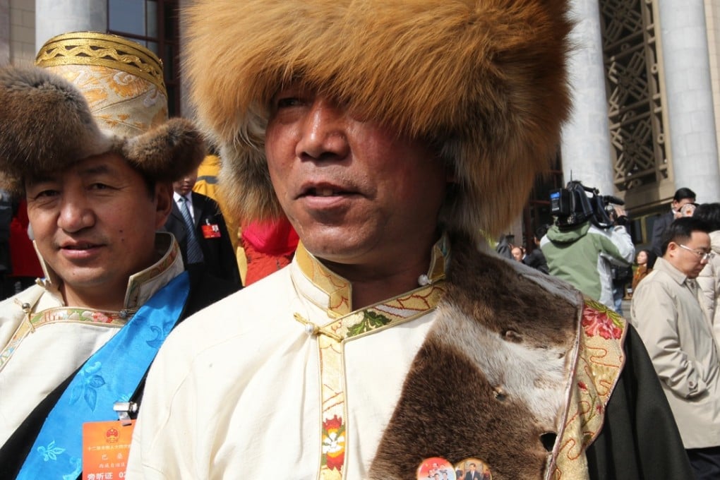 A Tibetan delegate to the Chinese People’s Political Consultative Conference said the badges were given to him last year on the 50th anniversary of Tibetan government. Photo: Simon Song