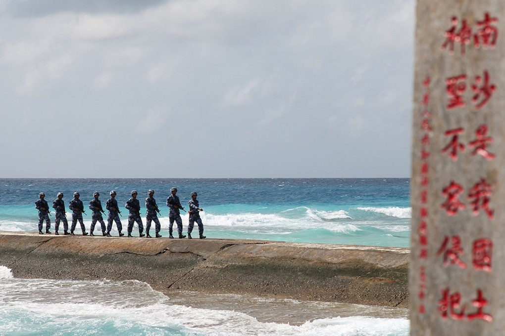 PLA troops stationed on a disputed island in the Spratly chain in the South China Sea. Photo: Reuters
