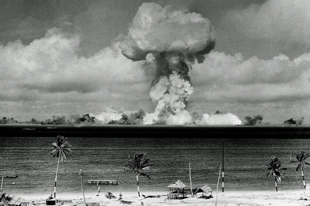 The mushroom cloud of an atom bomb rises among abandoned ships in Bikini lagoon, Marshall Islands, on July 1, 1946. Photo: AP