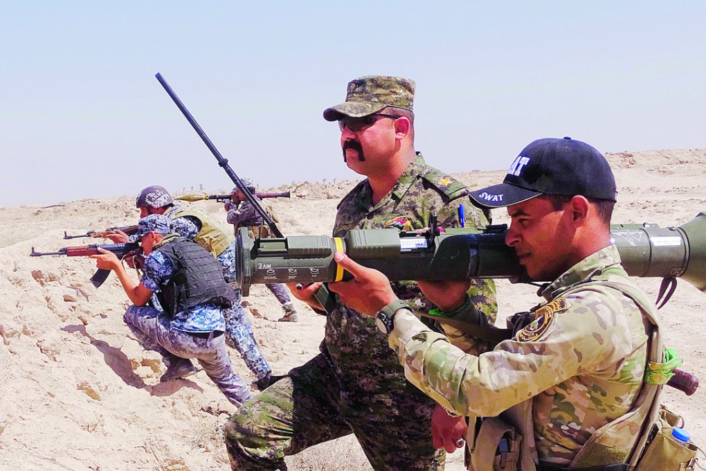 Iraqi Army soldiers with new U.S.-made weapons. Photo: AP
