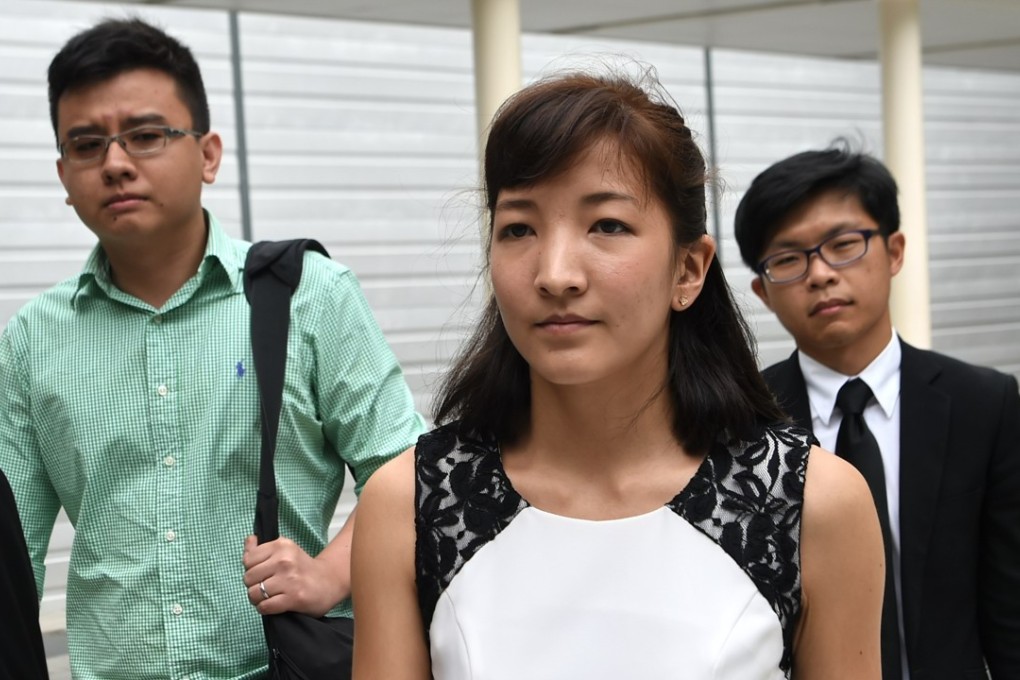 Australian Japanese Ai Takagi (front), 23, and her Singaporean husband Yang Kaiheng (left), 27, each face seven sedition charges for articles published between October 2013 and February 2015. Photo: AFP