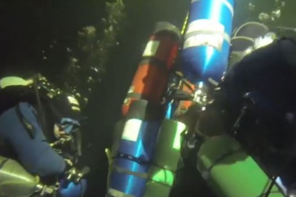 Maxim Astakhov and Alexander Gubin of the Russian Geographical Society test equipment during their 102-metre descent beneath sea ice on the White Sea on Saturday.. Photo: YouTube / Russian Geographical Society