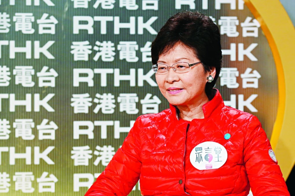 Chief Secretary Carrie Lam remained in her seat while being harangued and called the activists “old customers”. Photo: Edward Wong