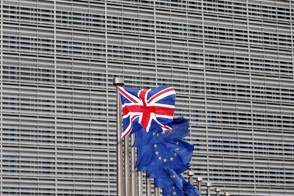 A Union Jack flutters next to EU flags at the EU’s headquarters in Brussels. Reuters