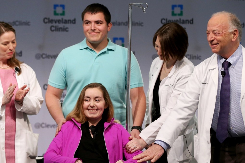 Patient Lindsey and her husband Blake face the media with Cleveland Clinic medical staff as they announce she was the recipient of the first uterus transplant in the US. Photo: AP