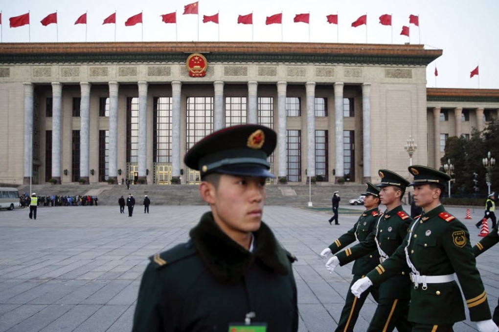 A soldier of the People’s Liberation Army (PLA) stands guard at the Great Hall of the People. Photo: Reuters