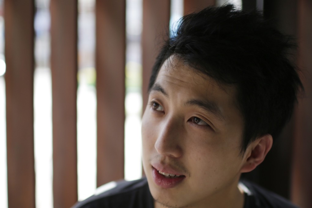 Hong Kong photojournalist Hok Chun Anthony Kwan speaks to reporters after leaving court in 2015. Photo: AP