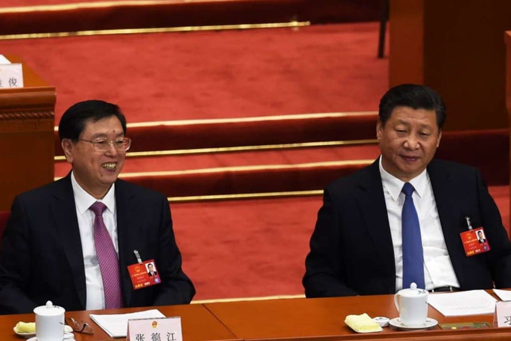 Chairman of the Standing Committee of the National People’s Congress (NPC) Zhang Dejiang (L) sits with Chinese President Xi Jinping. Photo: AFP