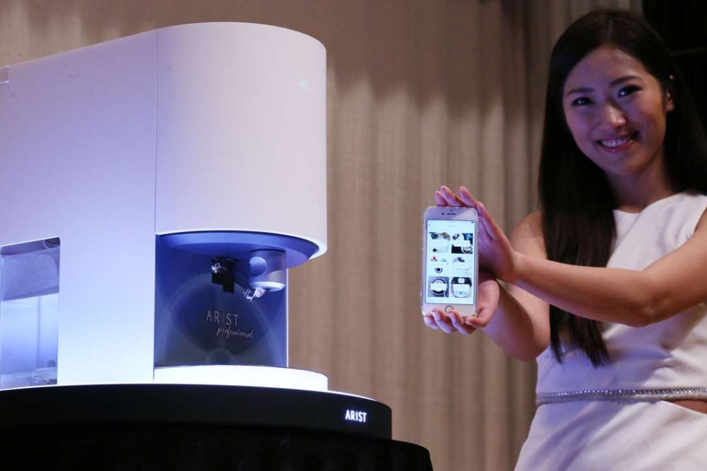 Nbition Development holds an unveiling ceremony to introduce their new Arist Professional smart coffee machine at the Hong Kong Science Park in Sha Tin on Tuesday. Photo: Nora Tam