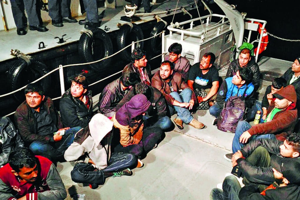Some of the South Asians after marine police detained them in Hong Kong waters. Photos: SCMP Pictures