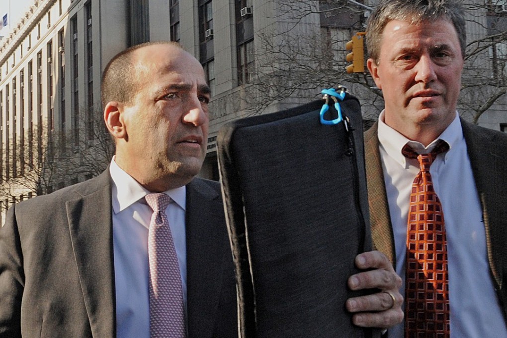 Former JPMorgan Chase & Co broker Michael Oppenheim (left) leaves federal court in New York on Tuesday after sentencing. Photo: Bloomberg