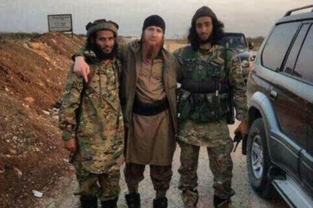 The Islamic State’s defacto defence minister, Omar al-Shishani (centre), is seen with fellow fighters in this image shared on social media. Photo: Twitter