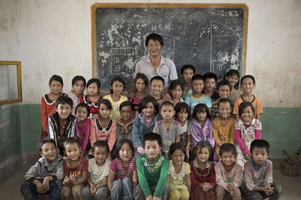 Children from Yongsheng county in Yunnan province pose in their classroom. A draft charity law spells out for the first time how charity groups would be able to operate in China. Photo: Wu Jiaxiang