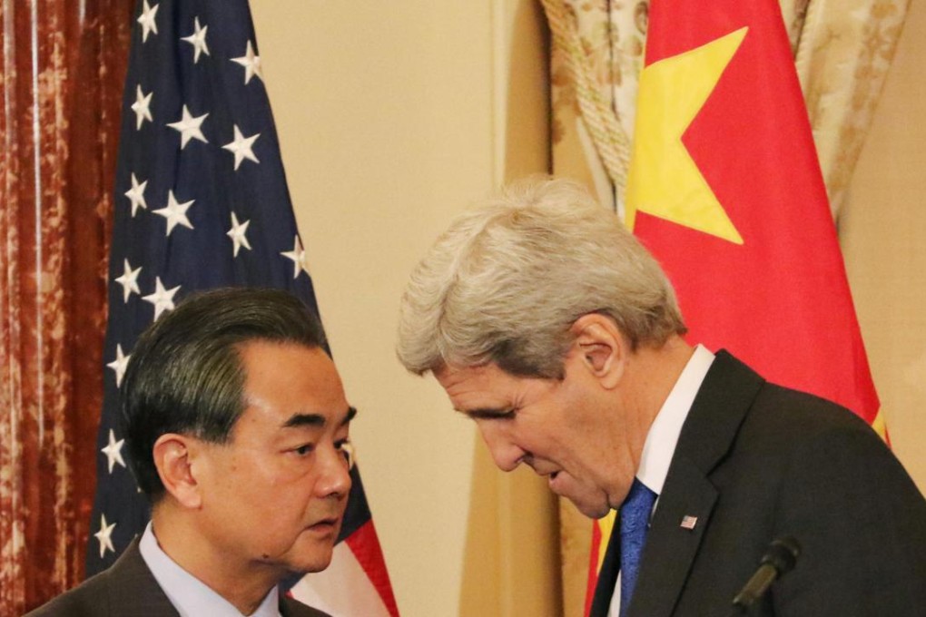 Wang Yi and US Secretary of State John Kerry pictured after talks held last month in Washington. Photo: Kyodo
