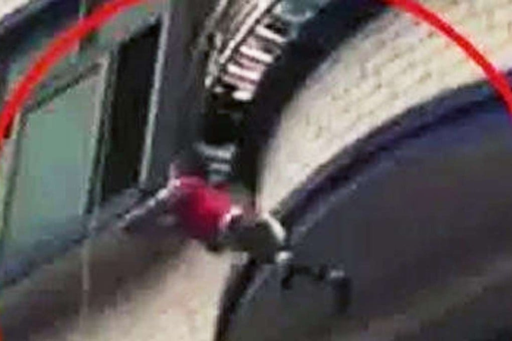 Chinese toddler Xiaojing is pictured falling from a fifth-floor balcony in Dongguan on Tuesday. Photo: Sina