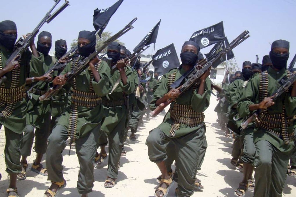 Al-Shabab fighters march with their weapons during military exercises on the outskirts of Mogadishu, Somalia. Photo: AP