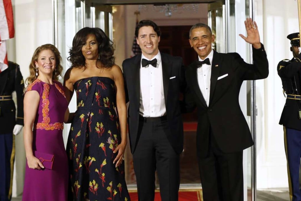 US President Barack Obama and first lady Michelle Obama pose for a photo with Canadian Prime Minister Justin Trudeau and Sophie Grégoire Trudeau at the North Portico of the White House on Thursday as they arrive for a state dinner. Photo: AP