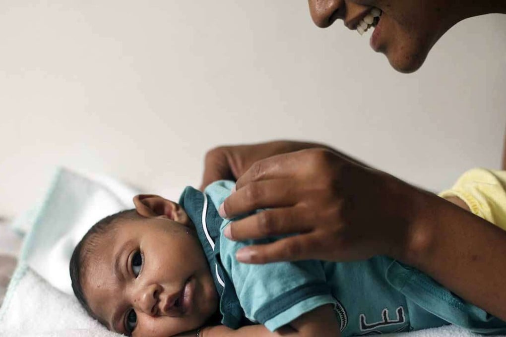 A mother with her four-month-old child who is suffering from microcephaly in Brazil. Photo: Reuters