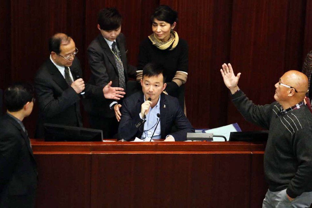 Lawmaker Raymond Chan Chi-chuen taking over the finance committee’s seat in protest. Photo: Felix Wong