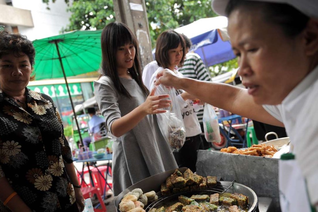 Bangkok’s street stalls are a big hit with Hong Kong travellers. Photo: AFP