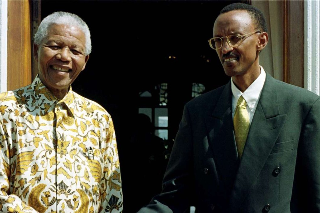 Nelson Mandela, left, with Paul Kagame in 1998, before Kagame became president of Rwanda. Kagame has convinced many that his Rwanda is a happy democracy. Photo: Reuters