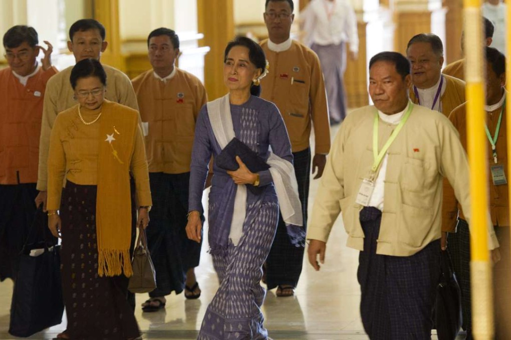 Myanmar politician Aung San Suu Kyi arrives at the lower house of parliament in Naypyidaw on March 11, 2016. Photo: AFP
