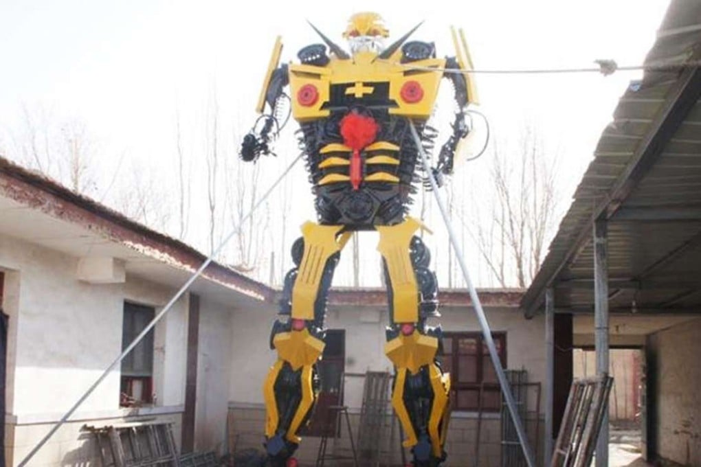 The finished 6.8 metre model towers over the courtyard where it was built. Photo: China News Service