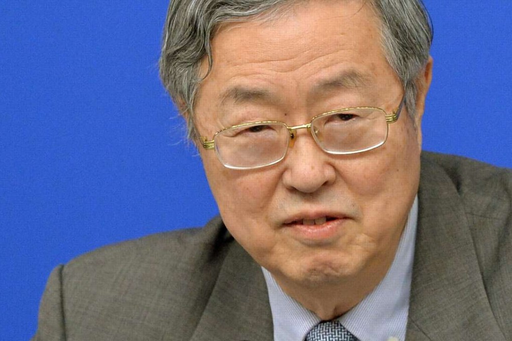 Zhou Xiaochuan, governor of the People's Bank of China, pictured at a meeting on Saturday, says he has confidence in dim sum bond markets. Photo: Kyodo