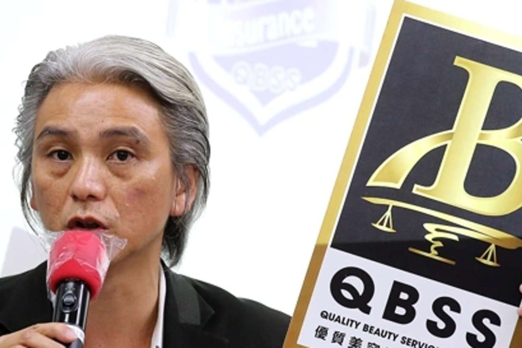 Federation of Beauty Industry chairman Nelson Yip Sai-hung shows off the accreditation logo. Photo: Dickson Lee