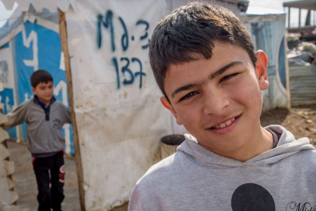 Ali vividly remembers the horrific attacks at his school. After fleeing Syria, the 12-year-old and his family now live in the Bekaa Valley of Lebanon. Ali does not attend school and sells tissue paper on the street to earn money for his family. Photo: World Vision