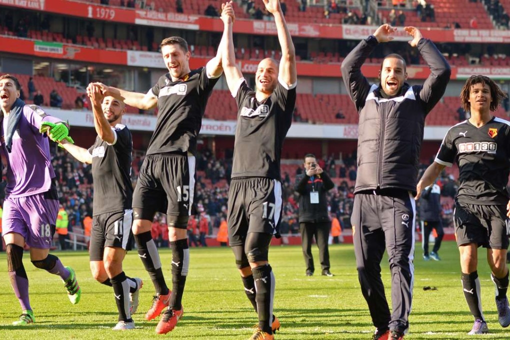Watford players celebrate in front of their fans after beating Arsenal 2-1 in an FA Cup quarter-final at the Emirates Stadium. Photo: Reuters