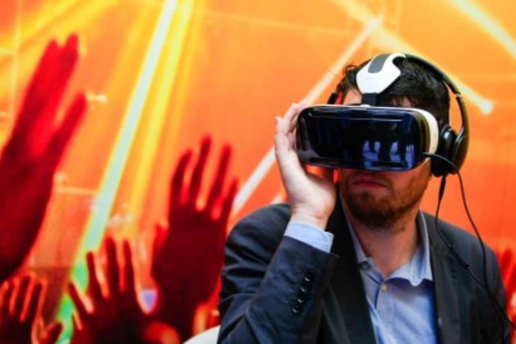 Samsung’s Gear VR requires a Galaxy smartphone from the same company be attached to provide it with a screen. By adding motion scanners and joysticks from Ximmerse, the user may feel more immersed in their virtual world. Photo: Bloomberg