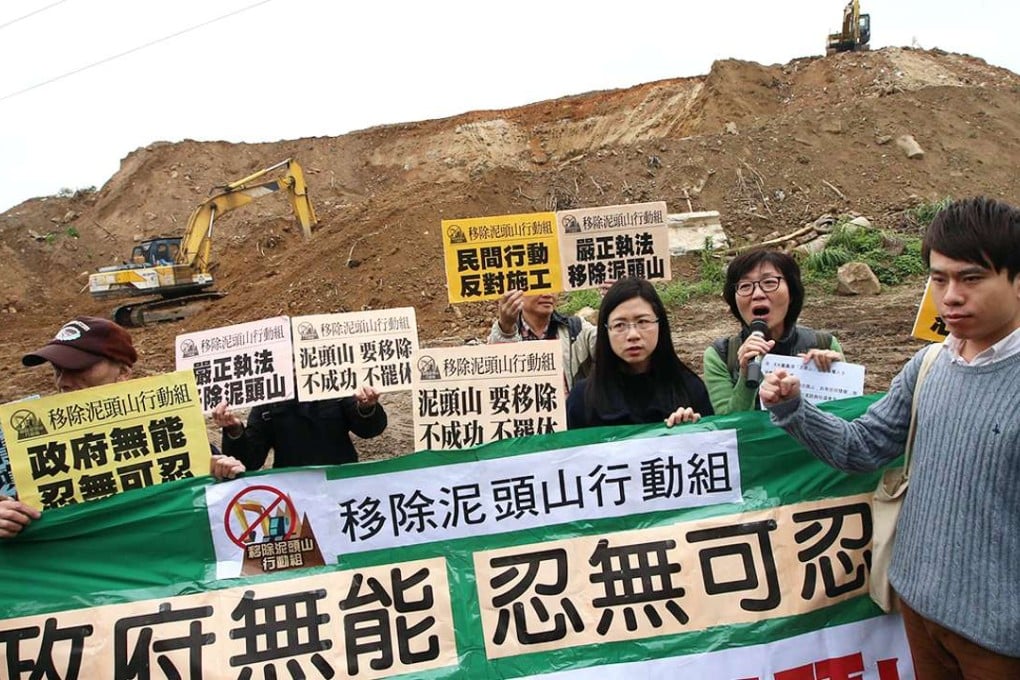 Yuen Long district councillor Kwong Chun-yu (right) joins protesters at the illegal building site. Photo: David Wong