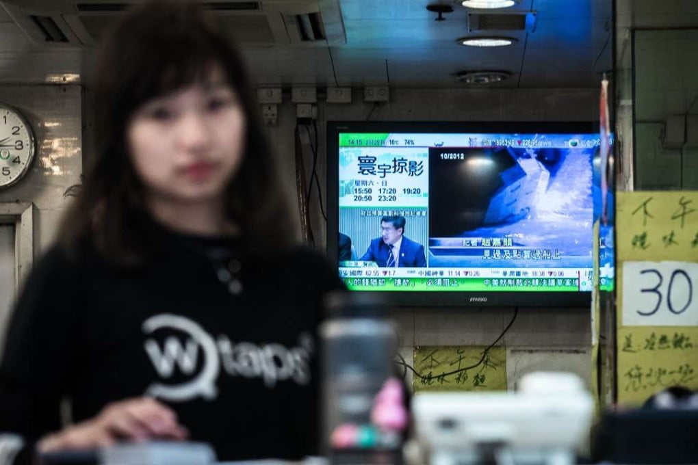 A TVB broadcast plays at a restaurant in Hong Kong. The station’s recent subtitling of Putonghua news in the mainland’s simplified characters has become another storm in Hong Kong’s language wars. Photo: AFP