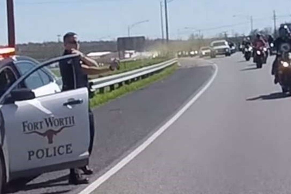 A Fort Worth police officer identified as W. Figueroa is shown in a video spraying what appears to be pepper spray at passing motorcyclists on Sunday. Photo: YouTube