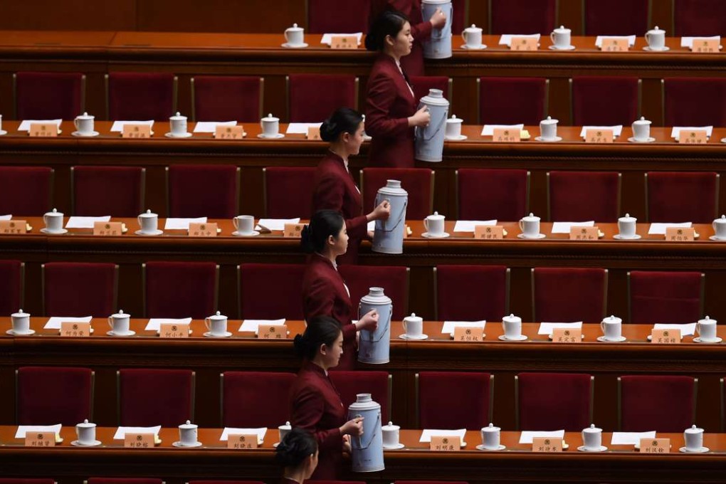 Attendants prepare tea for China’s leaders before the Chinese People's Political Consultative Conference closes at Beijing’s Great Hall of the People. Photo: AFP