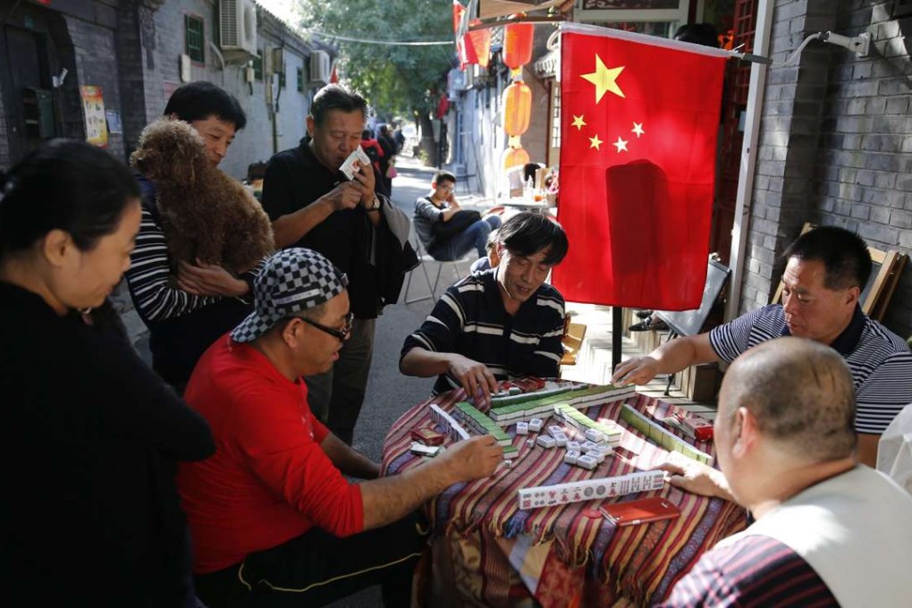 Residents play mahjong in a hutong in Beijing. Would they be more than a match for artificial intelligence? Photo: EPA