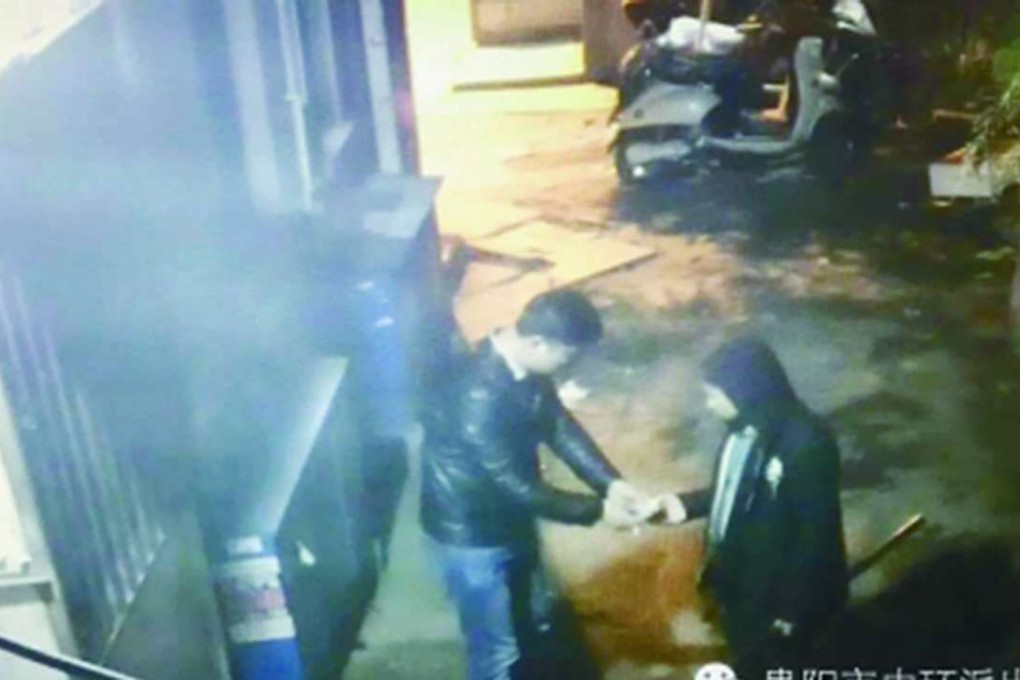 A photograph taken from CCTV footage, which reportedly shows the suspect in the case robbing a man in Guizhou province on February 29. Photo: Guizhou Business Daily