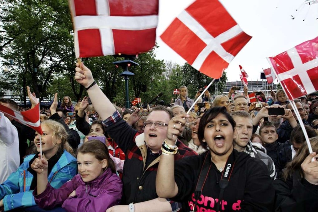 Revellers at the Tivoli amusement park in Copenhagen, Denmark. The nation reclaimed its place as the happiest country from Switzerland this year. Photo: AP