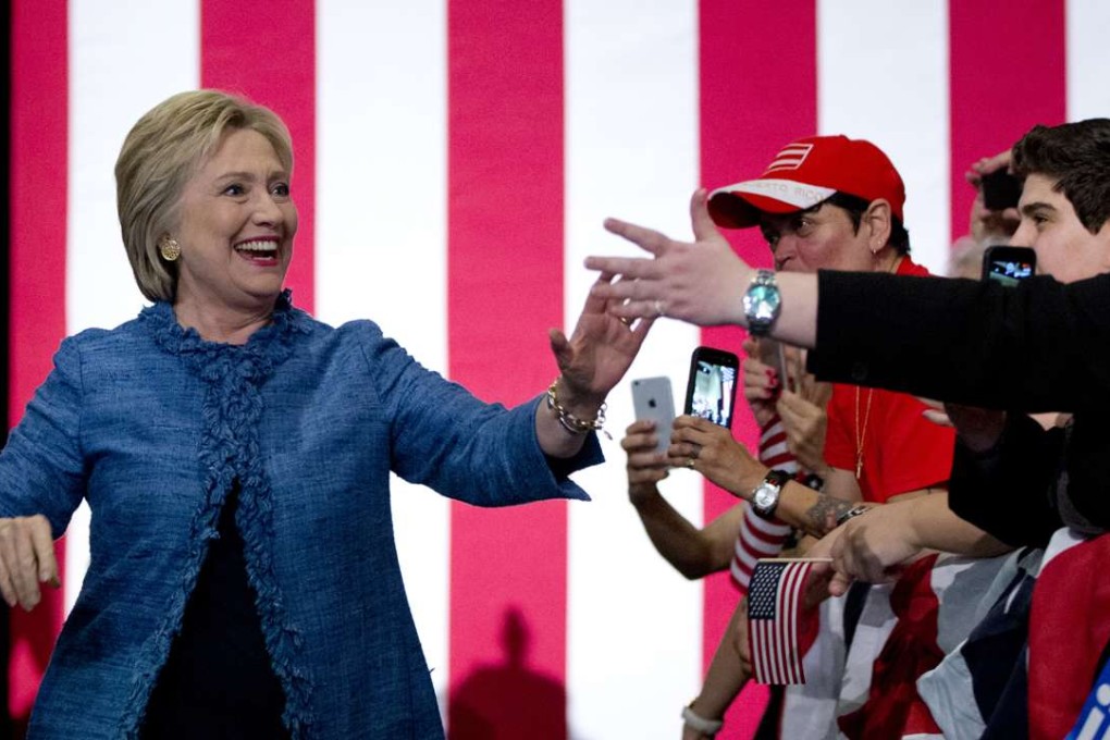 Democratic presidential candidate Hillary Clinton arrives to a cheering crowd at an election night event at the Palm Beach County Convention Center. Photo: AP