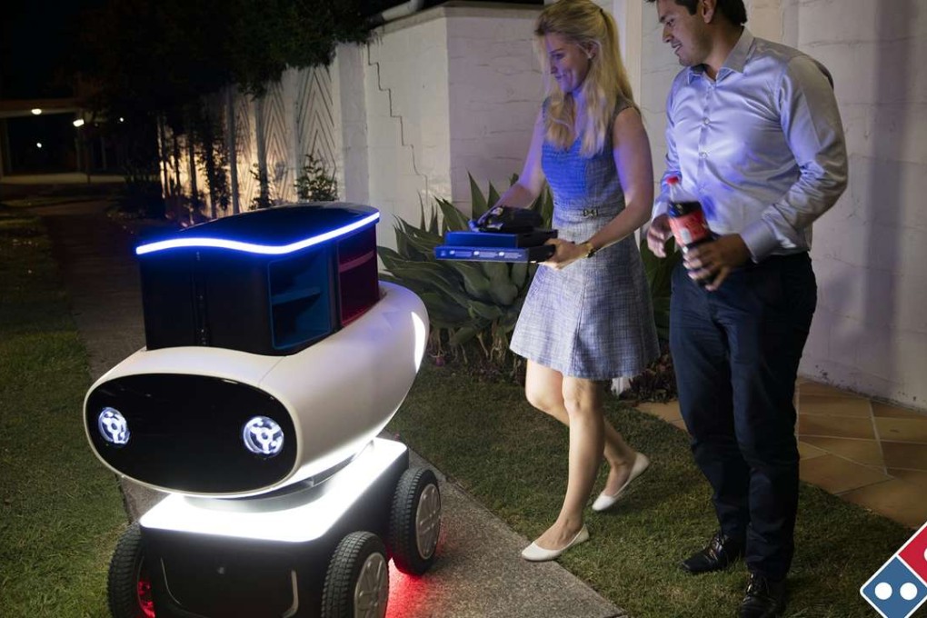 Domino's new trial pizza delivery robot is shown in New Zealand today. The company describes the hi-tech, driverless units as a world first. Photo: AFP