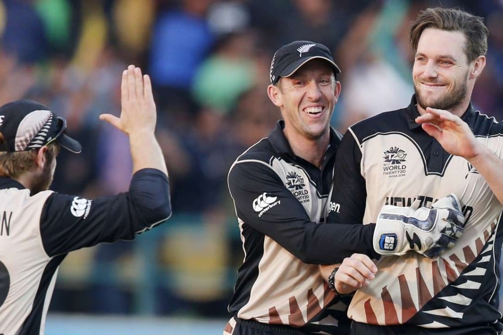 New Zealand's Mitchell McClenaghan (right) is congratulated by teammates Luke Ronchi and Kane Williamson after taking a wicket against Australia in their World Twenty20 match in Dharamsala. Photo: AP