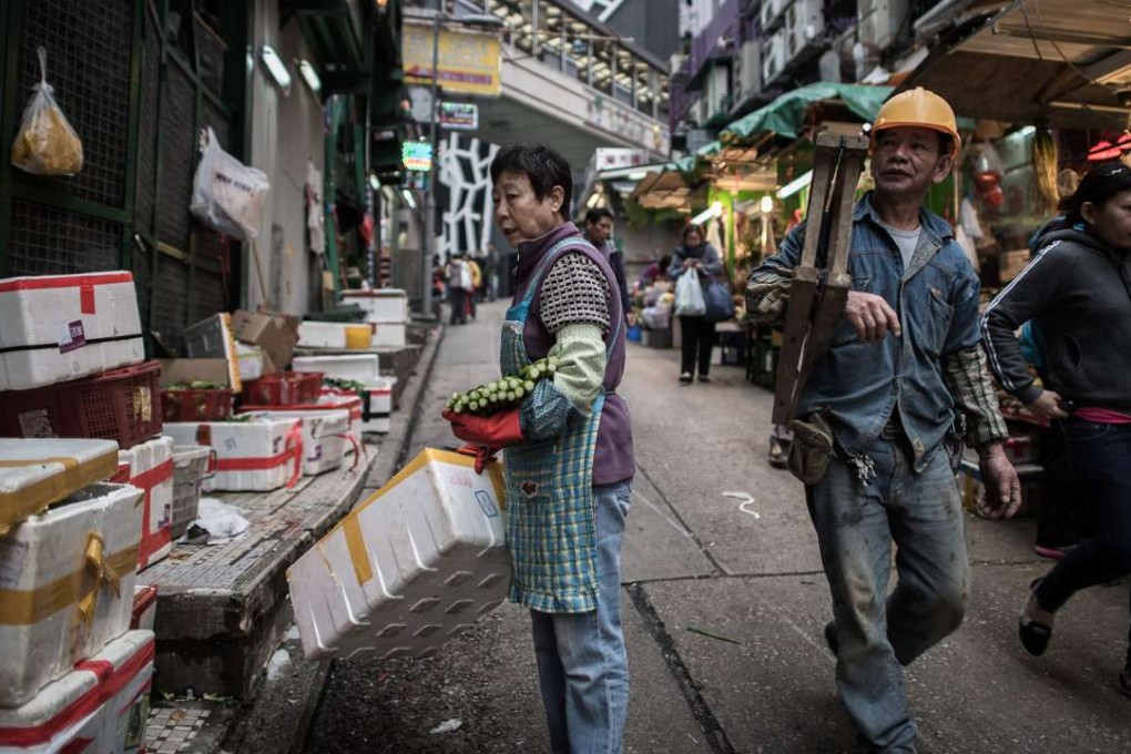 Instead of worrying about how to give HK$30 to a family so they can afford a “catty of contaminated vegetables”, what politicians and the public should be discussing is how to eliminate Hong Kong’s supermarket duopoly, the reason basic daily needs are so overpriced in the first place. Photo: AFP