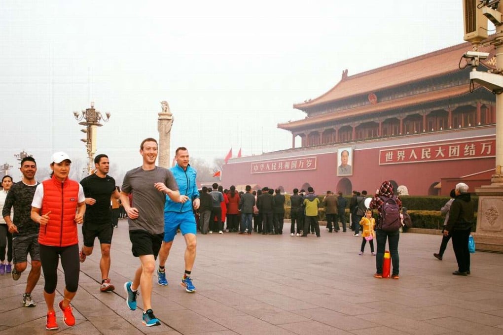 Facebook founder Mark Zuckerberg (wearing a grey shirt) posted this photograph of himself and five others running through Beijing’s Tiananmen Square on Friday. Photo: Facebook