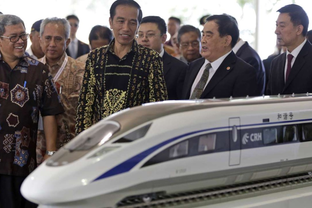 Indonesian President Joko Widodo with Sheng Guangzu, general manager of China Railway, at the groundbreaking ceremony for the Jakarta-Bandung fast-train railway line in Indonesia in January. Construction was suspended days later. Photo: Reuters
