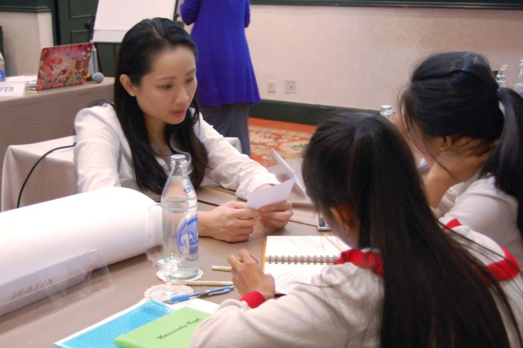 Youth Acata consultant Jennifer Ho with participants at a training workshop in Bangkok. Photos: Treat Asia