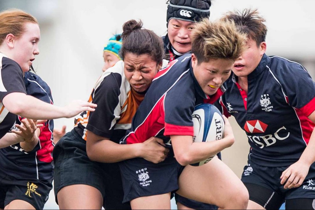Scorpions hooker Winnie Siu Wing-ni takes on Princeton’s defence. Photos: HKRU