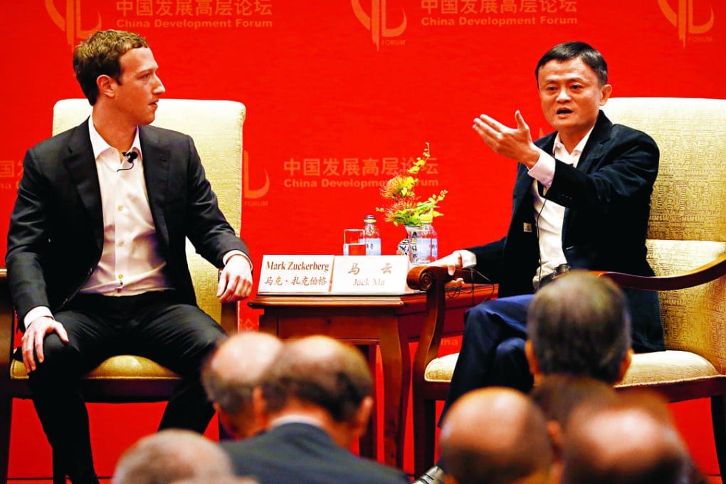 Mark Zuckerberg (left) founder of Facebook, listens to Jack Ma, founder of the Alibaba Group, during a discussion at Saturday’s China Development Forum in Beijing. Photo: AP