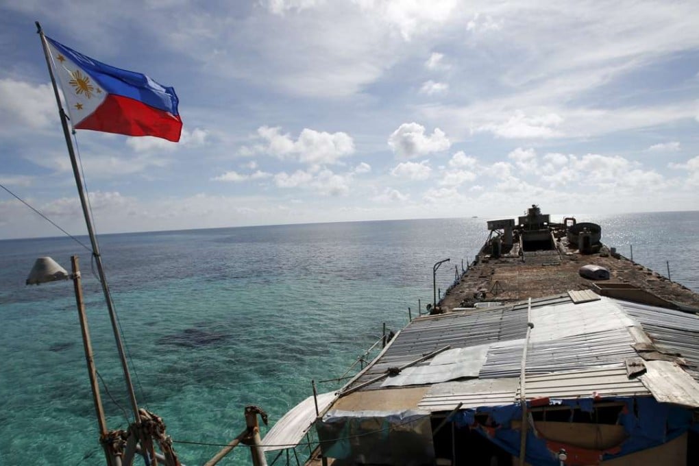 A Philippine flag flutters from BRP Sierra Madre in the Spratly Islands. Photo: Reuters