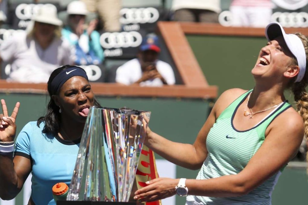 Serena Williams photo-bombs Victoria Azarenka’s trophy presentation after the final of the BNP Paribas Open at Indian Wells. Photo: Xinhua